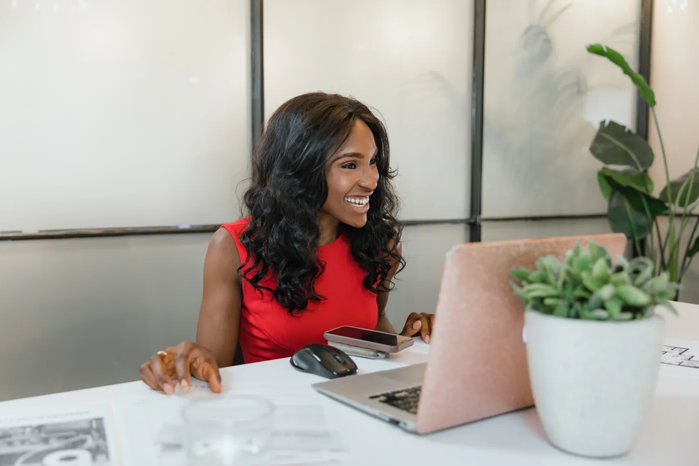 A business owner at her laptop taking an enquiry